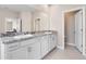 Bright bathroom with granite countertops, double sinks, and toilet at 33700 Hamilton Hill Ln, Wesley Chapel, FL 33545