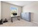Bright bedroom features carpet, a window, and desk and is ready for personalization at 33700 Hamilton Hill Ln, Wesley Chapel, FL 33545