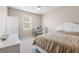 Bright bedroom offers a comfortable retreat with neutral walls, a ceiling fan and natural light at 33700 Hamilton Hill Ln, Wesley Chapel, FL 33545