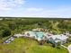 An aerial view of a community pool and clubhouse at 33700 Hamilton Hill Ln, Wesley Chapel, FL 33545