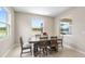 Dining room with view of backyard and abundant natural light at 33700 Hamilton Hill Ln, Wesley Chapel, FL 33545