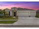 Charming single-Gathering home with a three-car garage and well-manicured lawn at 33700 Hamilton Hill Ln, Wesley Chapel, FL 33545