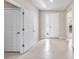 Bright foyer with tile flooring and a clear view of the home's entrance at 33700 Hamilton Hill Ln, Wesley Chapel, FL 33545