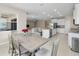 Open floor plan with kitchen, dining and living area at 33700 Hamilton Hill Ln, Wesley Chapel, FL 33545