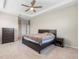 Spacious main bedroom with fan and neutral carpet flooring at 33700 Hamilton Hill Ln, Wesley Chapel, FL 33545