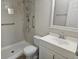 Bathroom features a walk-in shower, grab bars, and a bright vanity with a mirror at 3455 Countryside Blvd # 33, Clearwater, FL 33761