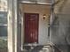 Close-up of an inviting townhouse front door and outdoor lighting at 3455 Countryside Blvd # 33, Clearwater, FL 33761