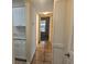 Hallway with tile flooring leading into multiple rooms at 3455 Countryside Blvd # 33, Clearwater, FL 33761