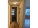 Hallway with neutral walls and views into multiple rooms at 3455 Countryside Blvd # 33, Clearwater, FL 33761