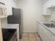 Bright kitchen boasts stainless steel appliances and white cabinets with elegant marble-look countertops at 3455 Countryside Blvd # 33, Clearwater, FL 33761