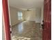 Bright living room featuring neutral walls, tile floors and a ceiling fan at 3455 Countryside Blvd # 33, Clearwater, FL 33761