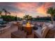 Outdoor patio featuring a fire pit, ample seating, and tranquil waterfront views at 3691 Center Cir, Largo, FL 33774