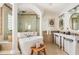Luxury bathroom with a soaking tub, walk-in shower, dual sinks, and neutral colors at 3691 Center Cir, Largo, FL 33774