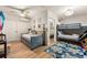 Versatile room with a daybed, bunk beds, playful decor, and laminate flooring, perfect for relaxation and fun at 3691 Center Cir, Largo, FL 33774