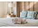 Bright bedroom with a unique headboard and plush bedding at 3691 Center Cir, Largo, FL 33774
