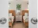 Charming bedroom featuring two beds and a stylish nightstand, seen through doorway at 3691 Center Cir, Largo, FL 33774