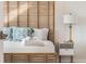 Cozy bedroom features a bamboo headboard and serene decor at 3691 Center Cir, Largo, FL 33774