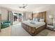 Bright bedroom with a bamboo bed frame, a ceiling fan, and outdoor access at 3691 Center Cir, Largo, FL 33774