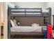 Bunk bed featuring soft lighting, a cozy bedding, and a modern look in a neutrally decorated room at 3691 Center Cir, Largo, FL 33774
