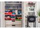 Open closet filled with games, Blu-ray discs, and a popcorn machine at 3691 Center Cir, Largo, FL 33774