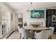 Elegant dining area featuring stylish chandelier and view to a bedroom at 3691 Center Cir, Largo, FL 33774