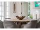 Charming dining room with a rustic table and modern chairs at 3691 Center Cir, Largo, FL 33774