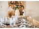 Dining room with neutral table setting and rustic wooden chairs, ready for a gathering at 3691 Center Cir, Largo, FL 33774
