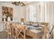 Inviting dining room showcasing a large table set for an elegant meal with wooden chairs at 3691 Center Cir, Largo, FL 33774