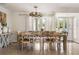 Beautiful dining room with rustic table, seating for eight, and stylish decor at 3691 Center Cir, Largo, FL 33774
