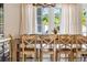 Charming dining room with seating for eight and a view of lush greenery at 3691 Center Cir, Largo, FL 33774