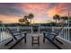 Relaxing dock view with comfortable seating and a picturesque waterfront setting at 3691 Center Cir, Largo, FL 33774