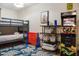 Fun game room with bunk beds, arcade game, connect four, and turtle themed area rug at 3691 Center Cir, Largo, FL 33774