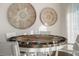 Entertaining game table featuring a poker set and decorative wall art, illuminated by natural light streaming through sheer curtains at 3691 Center Cir, Largo, FL 33774