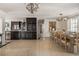 Open-concept living space featuring a modern kitchen, a dining area, and tile flooring throughout at 3691 Center Cir, Largo, FL 33774
