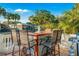 The covered outdoor kitchen is complete with bar seating and a gas grill at 3691 Center Cir, Largo, FL 33774