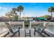 Relax in this outdoor lounge space with comfortable Adirondack chairs overlooking the water at 3691 Center Cir, Largo, FL 33774