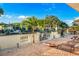 This outdoor brick patio features lounge chairs and a cornhole game, perfect for relaxing by the waterway at 3691 Center Cir, Largo, FL 33774