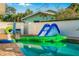 Backyard pool features fun inflatables, creating an exciting and playful atmosphere for outdoor entertainment and relaxation at 3691 Center Cir, Largo, FL 33774