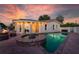 Stunning home with a backyard oasis featuring a gorgeous pool and a tranquil fountain at 3691 Center Cir, Largo, FL 33774