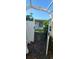 Private backyard entrance with a white fence and lush landscaping at 3717 Mckay Creek Dr, Largo, FL 33770