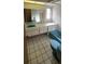 This bathroom features a vanity, mirror, sink, toilet, and bathtub at 3717 Mckay Creek Dr, Largo, FL 33770