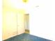 Bedroom with open door featuring carpet at 3717 Mckay Creek Dr, Largo, FL 33770