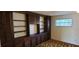 Bedroom featuring custom built-ins and natural light from the window at 3717 Mckay Creek Dr, Largo, FL 33770