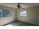 Bedroom features fan, windows, and natural light at 3717 Mckay Creek Dr, Largo, FL 33770