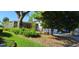 A beautiful one-story home with a brick exterior and lush landscaping, complemented by mature trees at 3717 Mckay Creek Dr, Largo, FL 33770