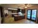 Kitchen with dark cabinetry, white countertops and views of the pool at 3717 Mckay Creek Dr, Largo, FL 33770