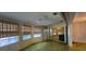 Sunny living room with large windows and an adjacent enclosed patio at 3717 Mckay Creek Dr, Largo, FL 33770