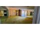 Bright and open living room with large windows and neutral walls at 3717 Mckay Creek Dr, Largo, FL 33770