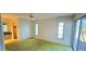 Spacious main bedroom with light walls, slider glass doors, and ample closet space at 3717 Mckay Creek Dr, Largo, FL 33770
