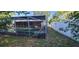 Outdoor screened pool area with a lush, green landscape at 3717 Mckay Creek Dr, Largo, FL 33770